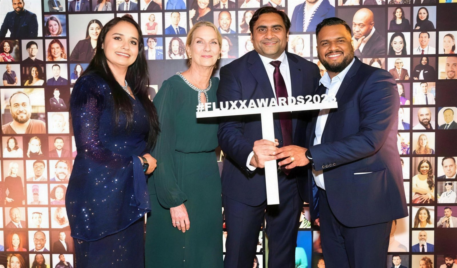 Sukh Sandhu with fellow award recipients at the Fluxx Awards 2023 event, showcasing professional development.