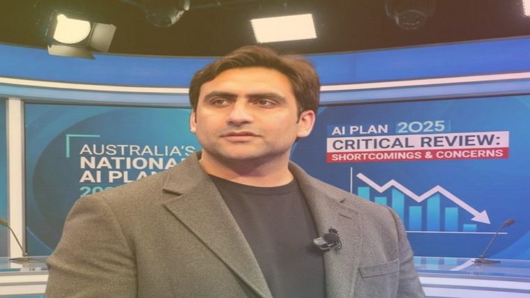 Australia’s AI Strategy | Sukh Sandhu A man speaks on television discussing Australia's national AI plan, relating to compliance and governance.