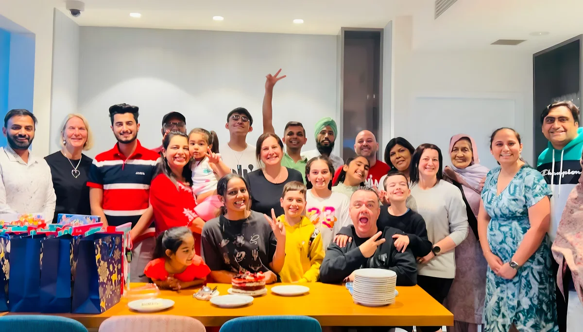 Sukh Sandhu with the team — photograph 18