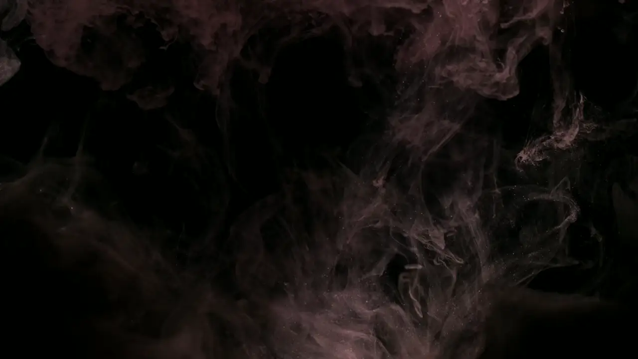 Ink Swirl | Sukh Sandhu Abstract swirls of mauve and gray ink blend into a dark background.