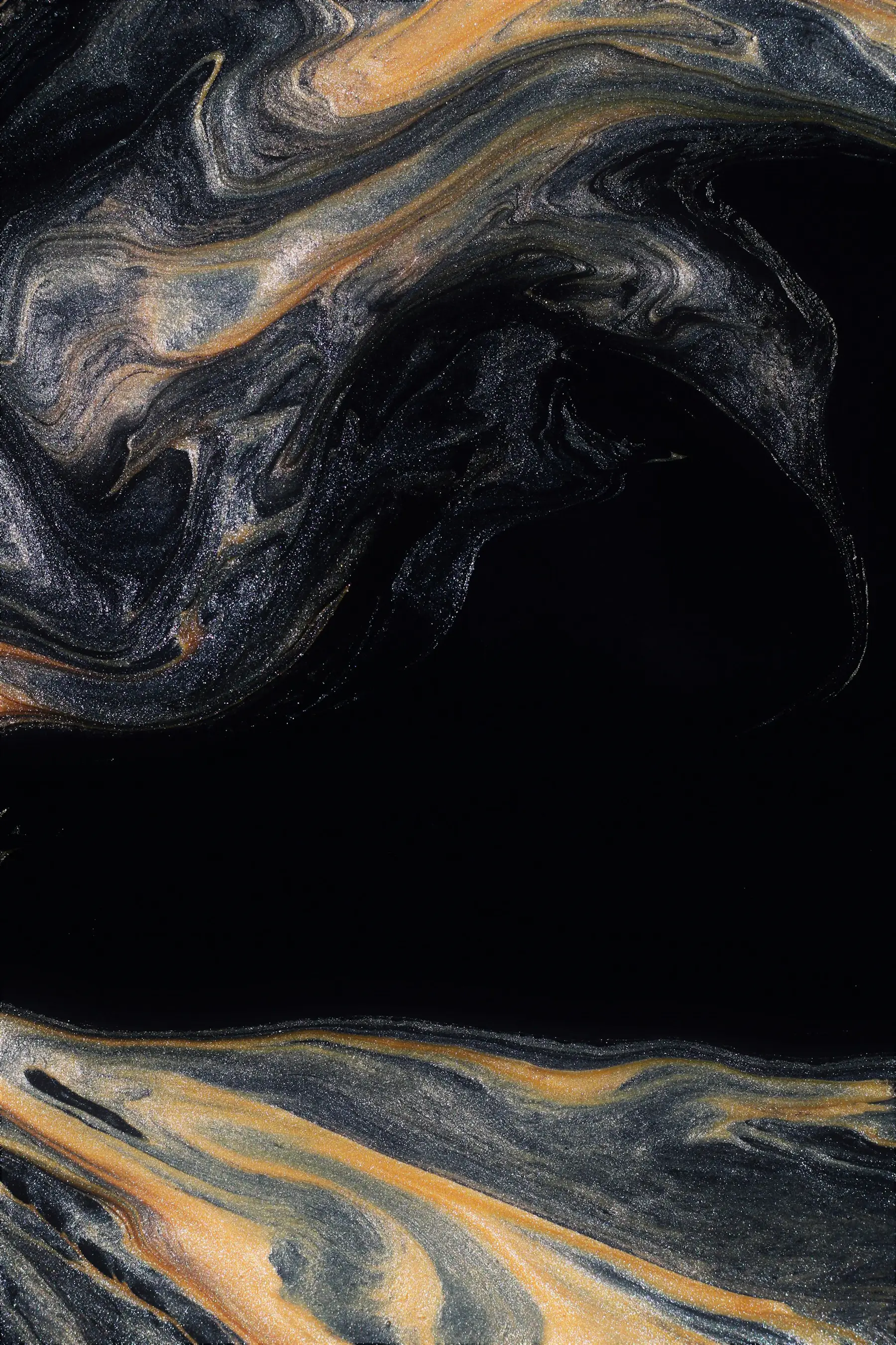 Abstract fluid art with swirling gold and black inks creates a marbled effect, enhancing the site's visual appeal.